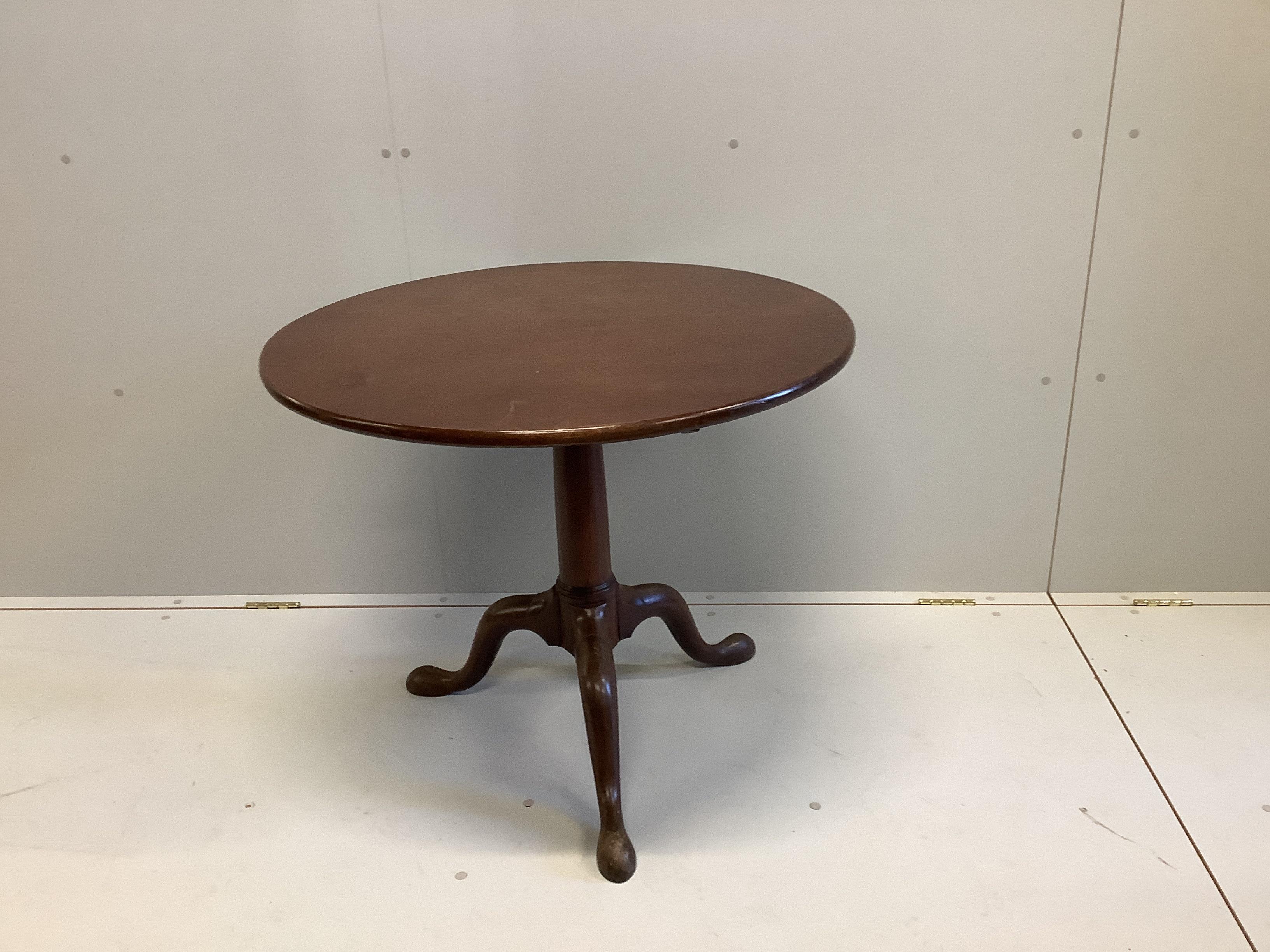 A George III circular mahogany tilt-top bird cage tripod tea table, diameter 84cm, height 70cm